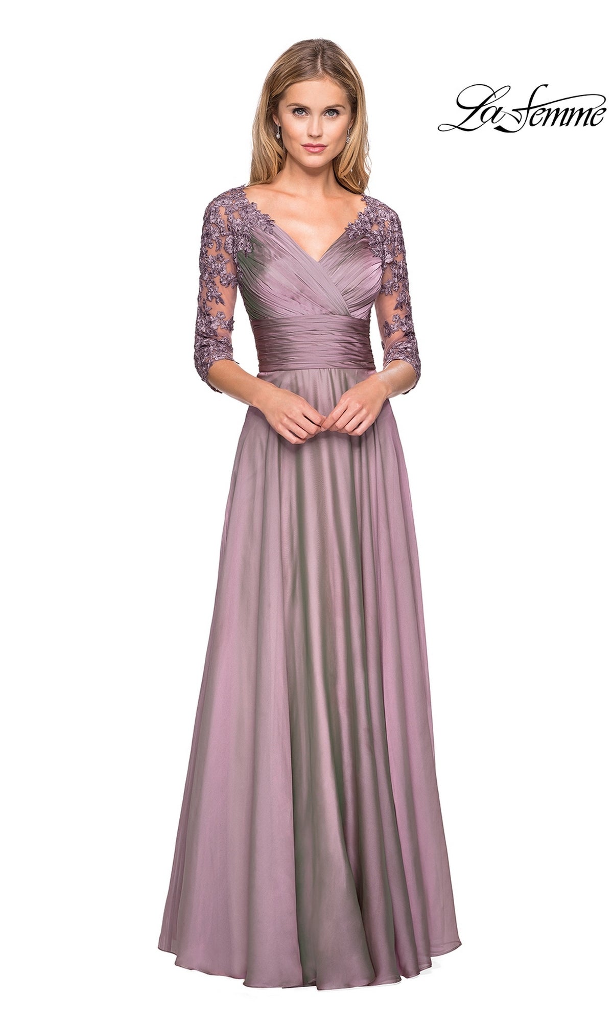 A woman wearing a La Femme 27153 floor-length dusty lilac chiffon formal dress with a V-neckline and three-quarter length lace sleeves, ideal for evening events.