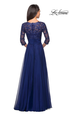 Back view of the Long Formal Dress: La Femme 27153, a navy blue chiffon gown featuring a lace bodice, three-quarter sleeves, and a sheer floor-length skirt.