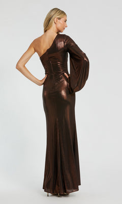 A person stands facing away, wearing the Long Formal Dress: Mac Duggal 27158—a striking, shiny copper-colored metallic gown featuring a one-shoulder design with a long sleeve on the left arm, exuding Mac Duggal’s signature sophisticated style.