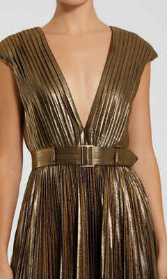 A person wearing the Pleated Long Bronze Evening Gown (Mac Duggal 27215) featuring metallic gold pleats, a deep V-neckline, and a matching belt for timeless elegance.