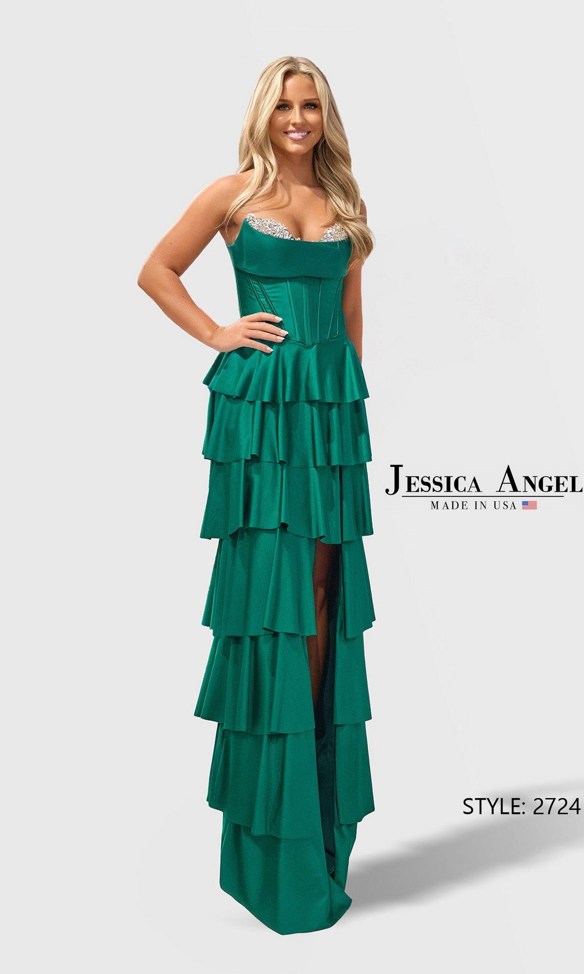 A woman models the Jessica Angel 2724 long prom dress in hunter, featuring a sleeveless corset bodice, ruffle tiered skirt with high slit, against a plain white background.