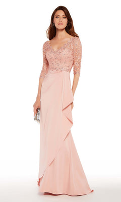 A woman in the Alyce 27242 long formal dress, featuring lace sleeves and a beaded lace bodice in light pink, holds a silver clutch—a sophisticated mother of the bride look.
