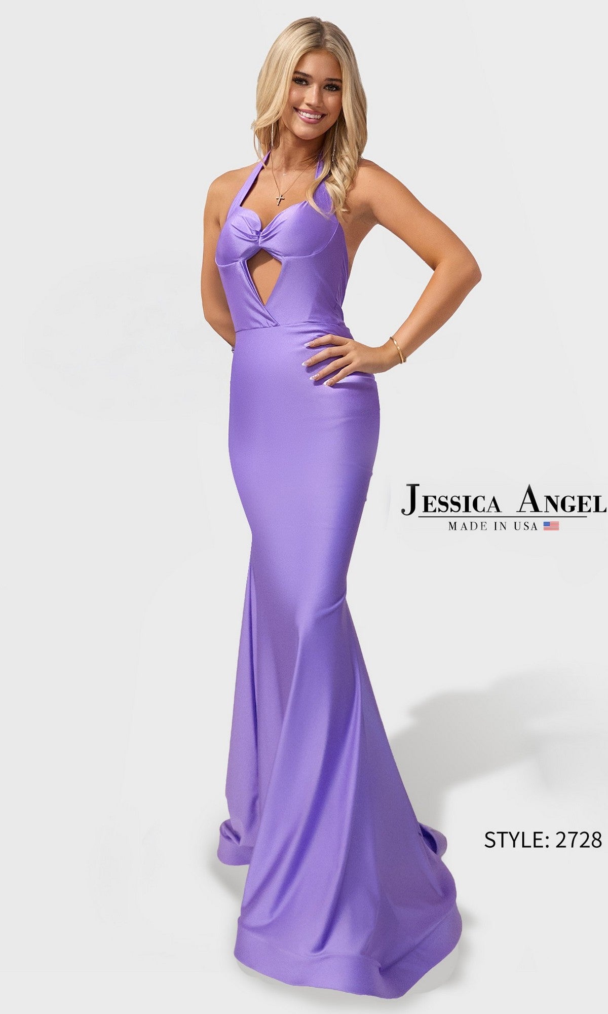 A woman poses and smiles in a Jessica Angel 2728 Long Prom Dress, color Lilac 2, featuring a floor-length, light purple halter design with stretch satin-jersey fabric and a keyhole cutout against a plain white background.