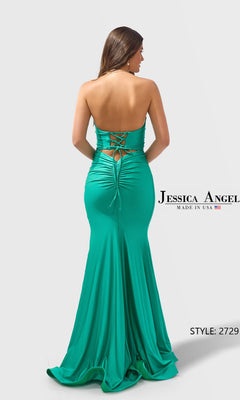 Woman wearing Long Prom Dress: Jessica Angel 2729, an emerald green satin-jersey, strapless floor-length gown with a lace-up back and ruched detailing, standing against a plain background.