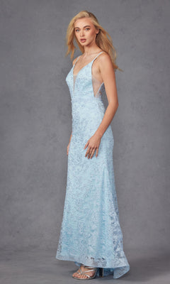 A woman poses against a plain gray backdrop wearing the Embroidered-Lace Long Beaded Prom Dress 272, a light blue, floor-length gown with sparkling details and thin straps.