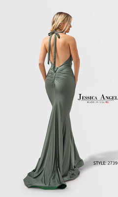 A woman poses against a plain background in the Jessica Angel 2739 Long Prom Dress—sage green, fitted, with a halter neckline, ruched details, and open back.
