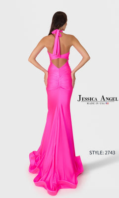 A woman, seen from behind, wears the Long Prom Dress: Jessica Angel 2743—a vibrant pink halter-neck gown with ruched details, high slit, and open back.