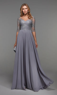 A woman models the Alyce 27475 long formal dress in grey, featuring lace sleeves and a fitted bodice, against a plain grey background.