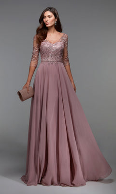 Woman in a rosewood Alyce 27475 long formal dress with a lace bodice, sheer sleeves, and chiffon skirt holds a matching clutch—an elegant mother-of-the-bride look—posed against a plain background.