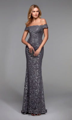A woman poses against a plain gray background in the Alyce 27485 long formal dress, a floor-length grey/silver off-the-shoulder gown, holding a small black clutch—an elegant mother of the bride choice.