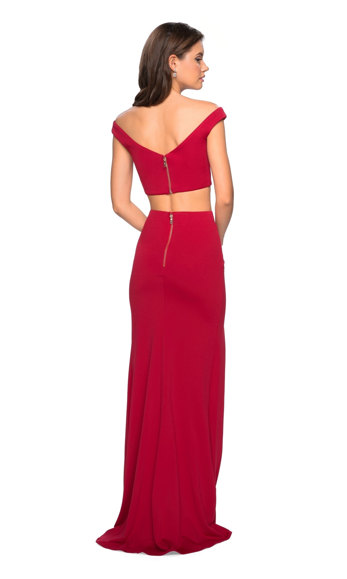 A woman wearing the La Femme 27496 Off-Shoulder Two-Piece Prom Dress in red, featuring a fitted design and visible back zippers, stands against a white background.