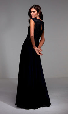 A woman wearing the Alyce 27504 long formal dress—an elegant A-line chiffon gown with a lace bodice—stands with her back partially turned and hands clasped behind her in a plain studio setting.