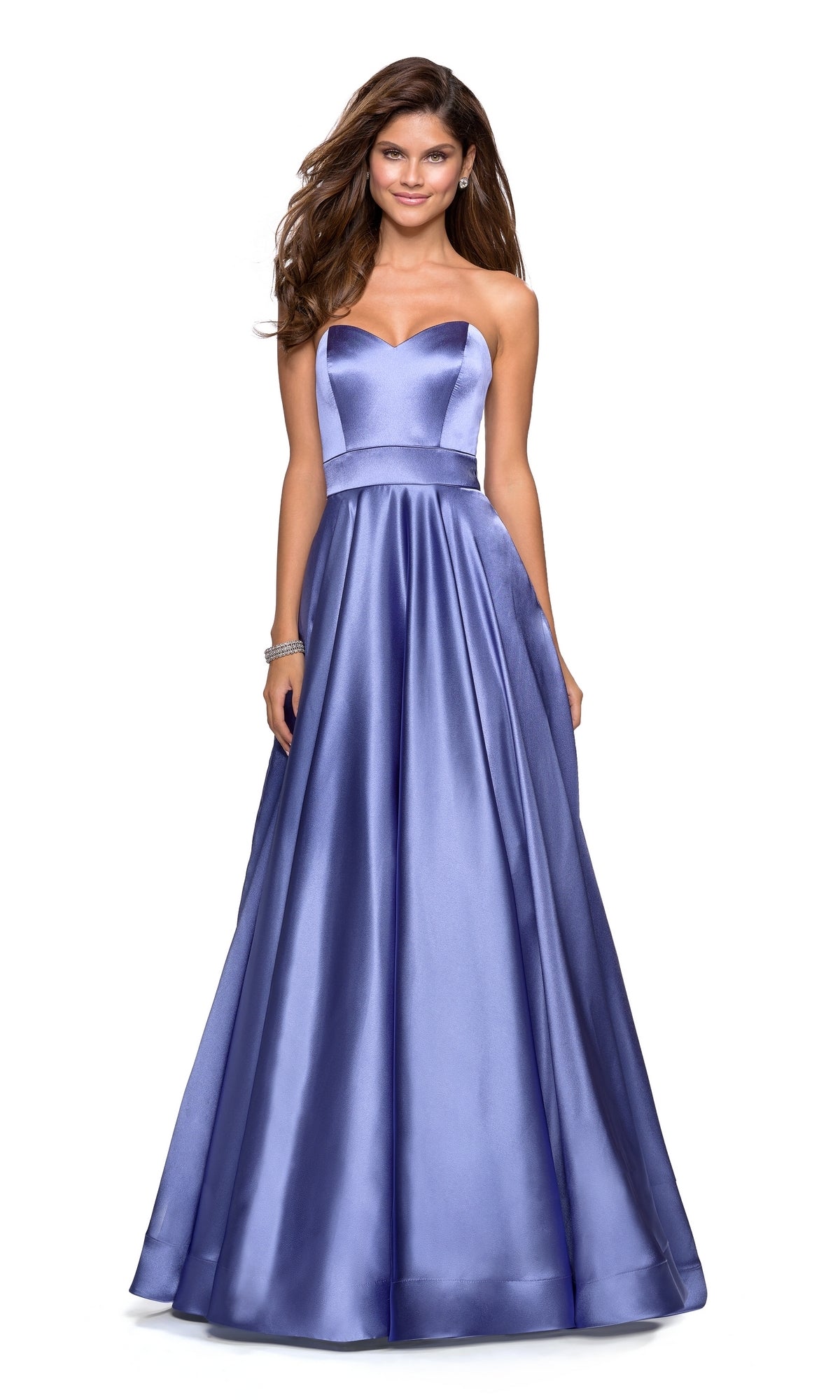 Woman wearing the La Femme 27506 strapless A-line satin prom dress in dark periwinkle, featuring a fitted bodice and full skirt, stands smiling against a white background.