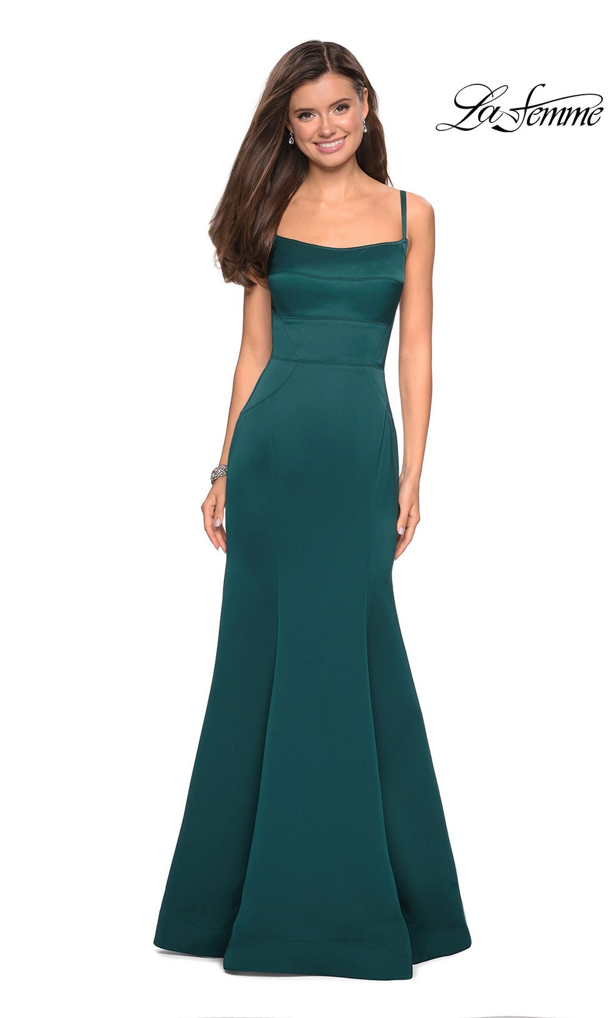 A woman models the La Femme Square-Neck Simple Long Prom Dress 27524—an emerald green, sleeveless, floor-length gown with a fitted bodice and mermaid skirt—standing against a white background with the 