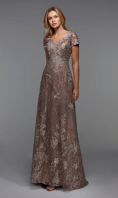 A woman wears the Alyce 27525 long formal dress in shadow grey, featuring short sleeves and silver floral embroidery, standing against a plain gray background.