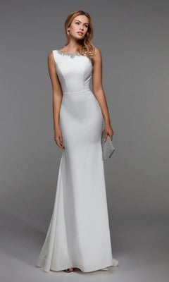 A woman stands against a plain gray background wearing the Alyce 27538 long diamond white sleeveless formal dress with an embellished neckline, holding a silver clutch.