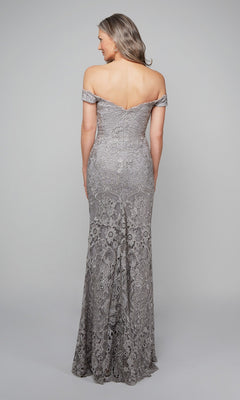 A woman models the Alyce 27553 long formal dress, featuring off-the-shoulder beaded lace in silver, floor-length, with her back to the camera against a plain background.