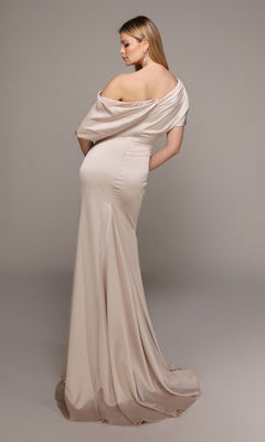 A woman poses with her back to the camera in a neutral studio, wearing the Alyce 27560 long formal dress—an off-the-shoulder, floor-length satin evening gown in light beige.