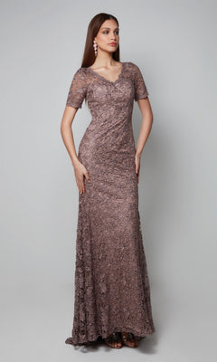 Woman wearing the Alyce 27561 long formal dress in smoke, featuring short sleeves and a V-neckline, perfect as a mother-of-the-bride gown, standing against a plain light gray background.