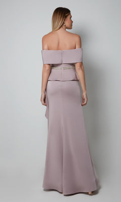 A woman is seen from the back wearing the Alyce 27563, a light mauve, off-the-shoulder, floor-length formal dress with a fitted waist and beaded belt, set against a plain background.