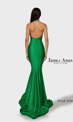 A woman models the Jessica Angel 2758 long prom dress, a fitted, backless green halter gown with a sleek floor-length silhouette, standing against a plain light background.