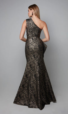 A woman models the Long Formal Dress: Alyce 27620—a metallic, one-shoulder gown with a fitted waist—standing against a plain gray background, facing away from the camera.