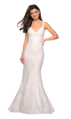 A woman wearing the La Femme 27623 Open-Back Lace Mermaid Prom Dress, a sleeveless, floor-length gown with a V-neckline, poses and smiles against a plain white background.