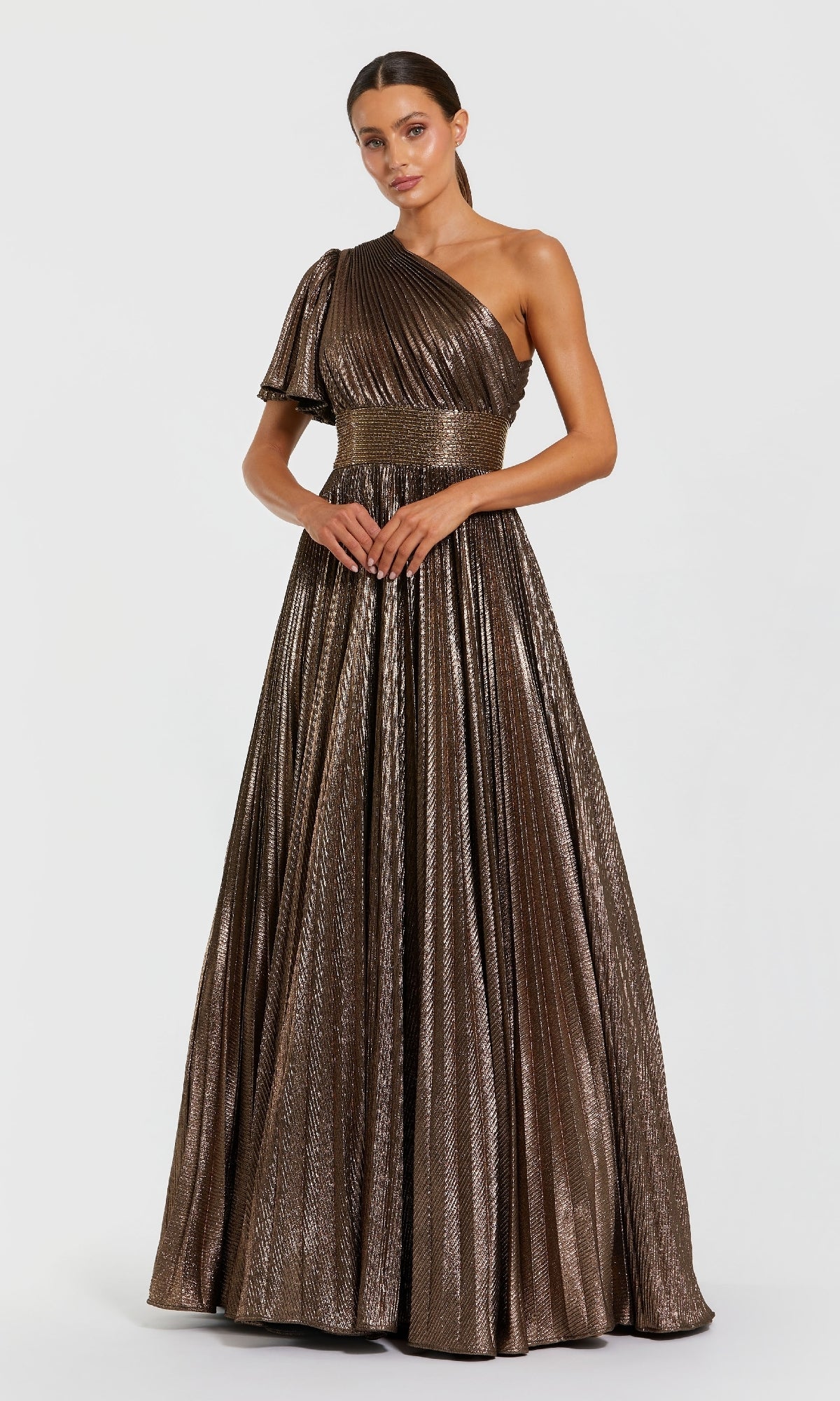 Woman wearing a bronze one-shoulder evening gown on a white background