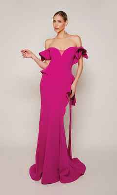 A woman models the Alyce 27643 long formal dress—an off-the-shoulder, floor-length gown in bright pink with ruffle accents and a fitted silhouette—posed against a plain background.