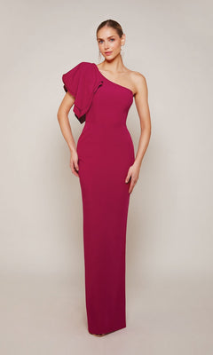 A woman wearing the Alyce 27644 long formal dress in magenta, featuring a ruffled detail on the left shoulder, stands against a plain background.