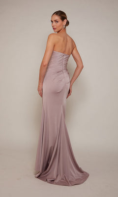 Woman models the Alyce 27658 long formal dress in mauve satin, strapless and floor-length, posing with her back slightly turned—a refined option for mothers of the bride.