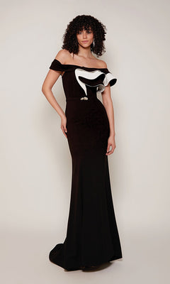 A woman models the Alyce 27672 long formal dress—an off-the-shoulder black sheath with a two-tone ruffle—against a plain background.