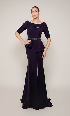 A woman wears the Alyce 27679 long formal dress—a dark purple, floor-length peplum style with short sleeves, a belted waist, and a front slit—against a plain light background.