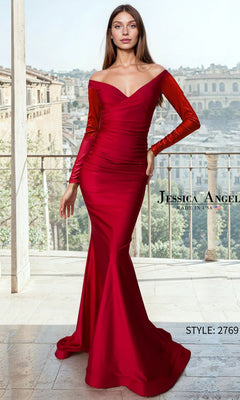 A woman in a fitted, off-the-shoulder satin mermaid long prom dress (Jessica Angel 2769) in dark red with long sleeves stands on a balcony, European cityscape behind her. "Jessica Angel" and "STYLE: 2769" shown.