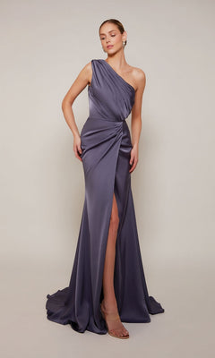 A woman models the Alyce 27697 long formal dress—a floor-length, one-shoulder satin gown in muted purple with a thigh-high slit—against a plain background, highlighting its elegant style ideal for prom.
