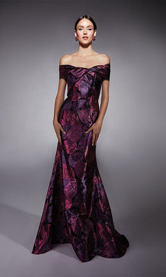 A woman poses in the Alyce 27702 long formal dress in fuchsia, featuring an off-the-shoulder, floor-length jacquard design—ideal for a mother of the bride—against a gray studio background.