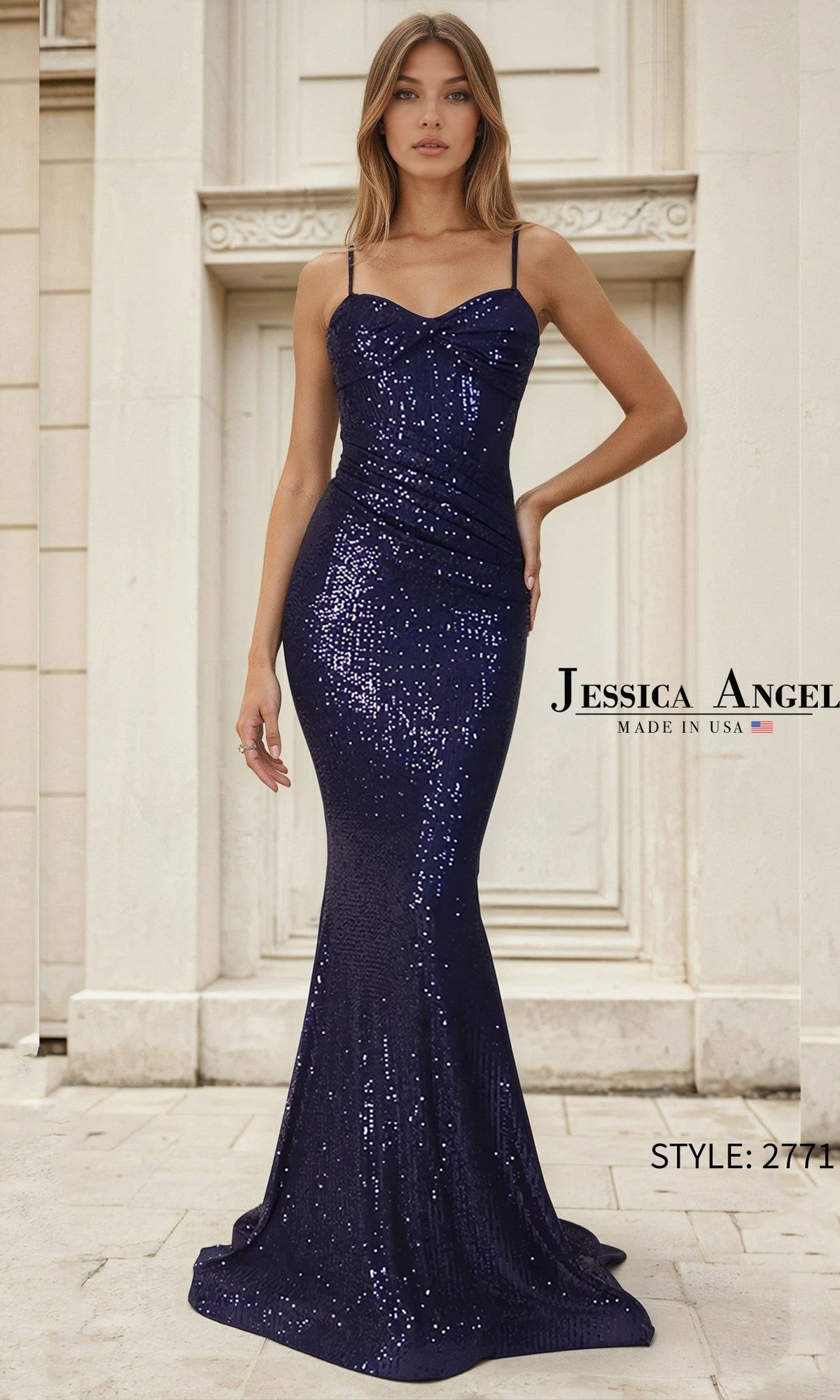A woman in the Jessica Angel 2771 Long Prom Dress, featuring a fitted mermaid silhouette with thin straps and navy sequins, stands before a light stone building. Text: 