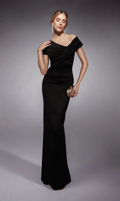 A woman models the Long Formal Dress: Alyce 27710, an elegant off-the-shoulder black gown, holding a small clutch and posing against a neutral gray background.