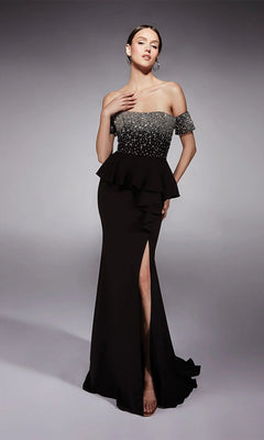 A woman poses in the Alyce 27715 long formal dress in Black/Silver, showcasing a beaded peplum bodice, fit and flare silhouette, and high leg slit against a plain gray background.