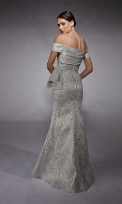 A woman models the Alyce 27717, an off-the-shoulder, floor-length jacquard formal dress with a side bow detail, seen from behind against a plain studio backdrop.