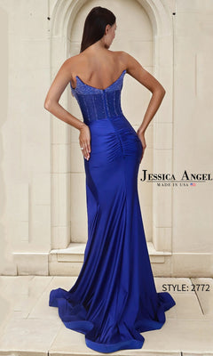 A woman models the Long Prom Dress: Jessica Angel 2772, featuring a royal blue strapless design with a satin sheath skirt, ruched back, and fitted beaded bodice.