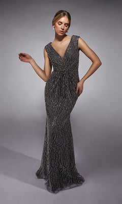 A woman stands against a plain background wearing the Alyce 27725 Long Formal Dress, a sleeveless, floor-length sequin evening gown with a fitted sheath silhouette and deep V-neckline.
