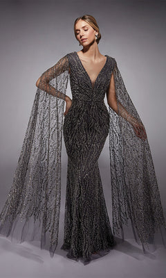 A woman poses against a neutral background wearing the Alyce 27725 long formal dress—an elegant, fitted sheath gown with intricate metallic beadwork and dramatic sheer cape sleeves.