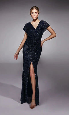 A woman in a midnight Alyce 27729 long formal dress featuring sequins, short sleeves, and a front slit stands against a plain gray background.