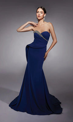 A woman in a royal Alyce 27739 long formal dress with a strapless sweetheart neckline and jeweled diagonal accent poses against a plain gray background.