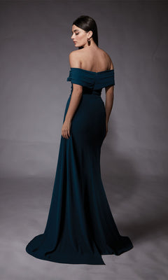 Woman in the Long Formal Dress: Alyce 27745 stands turned slightly away, posing against a plain gray backdrop—perfect for elegant prom style.