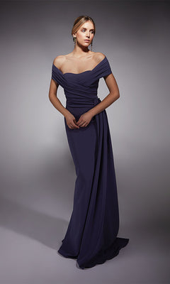 Woman in Alyce 27745, a floor-length off-the-shoulder formal dress in dark purple with draped fabric, stands against a gray background—an elegant prom look.