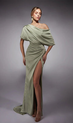 A woman in the Alyce 27748 long formal dress in celadon, featuring an off-the-shoulder satin design with a ruched bodice and high-leg side slit, stands against a plain gray background.