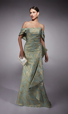 A woman stands against a plain gray background wearing the Alyce 27750 long formal dress in sea glass/gold, featuring an off-the-shoulder metallic jacquard brocade design with a mermaid skirt and holding a rectangular clutch purse.