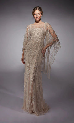 A woman models the Alyce 27754, a floor-length pink champagne formal gown with intricate beading and sheer draped sleeves—an elegant choice for a distinguished mother-of-the-bride.
